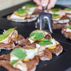 The Pros and Cons of Catering Your Own Events
